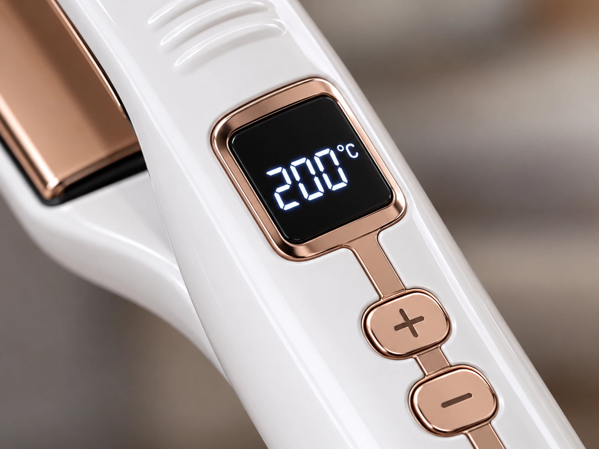 Close-up of the 1092S handle LCD display showing 200 degrees Celsius, with the rose-gold buttons below it